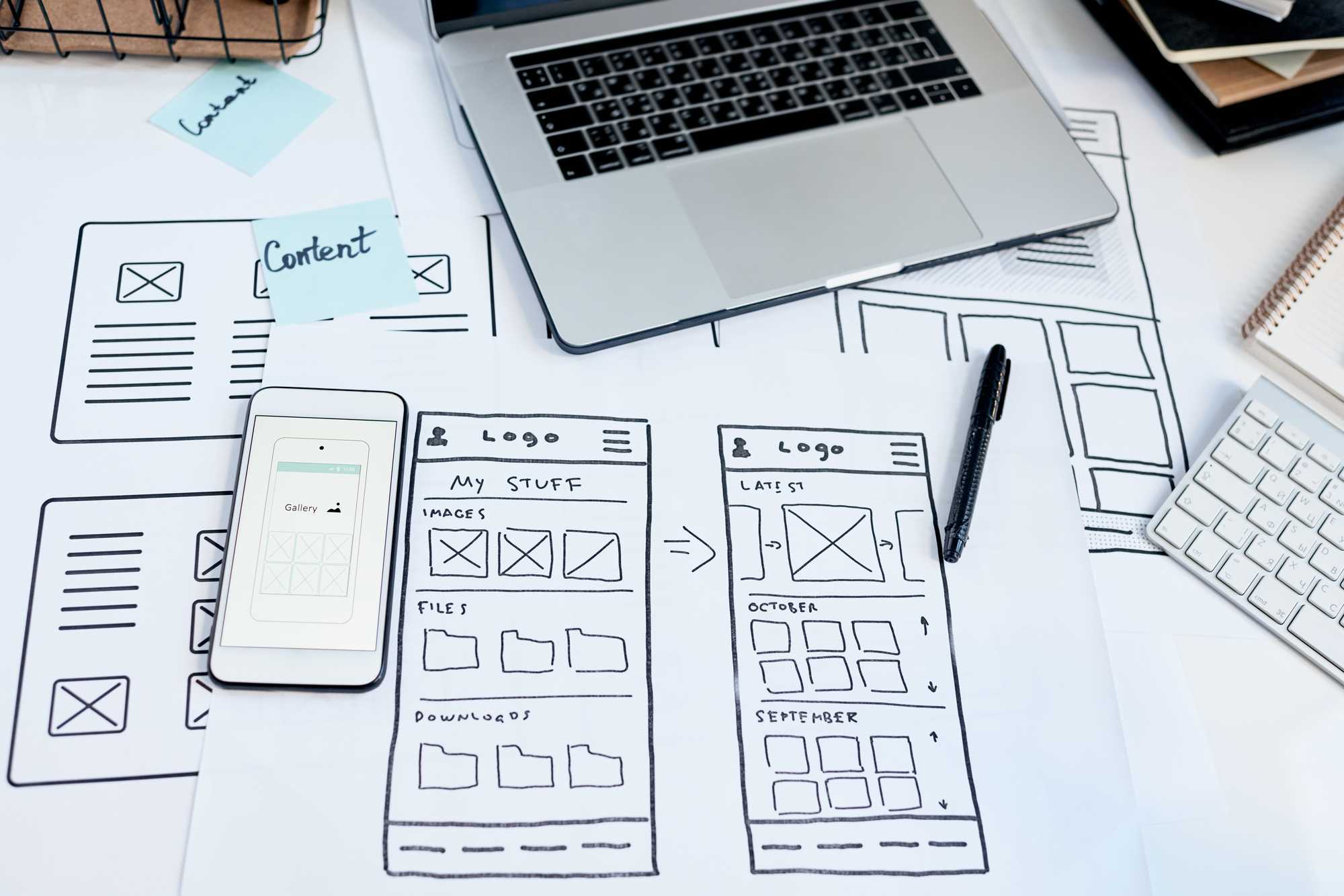 close-up-workplace-user-interface-designer-creating-usable-application-devices-sketches-smartphone-table
